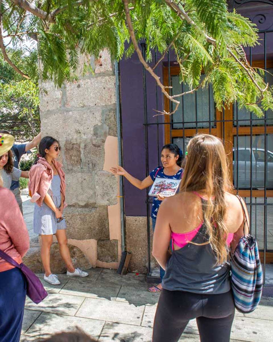 Bailey listens to a guide on a-tour-in-Oaxaca-Mexico