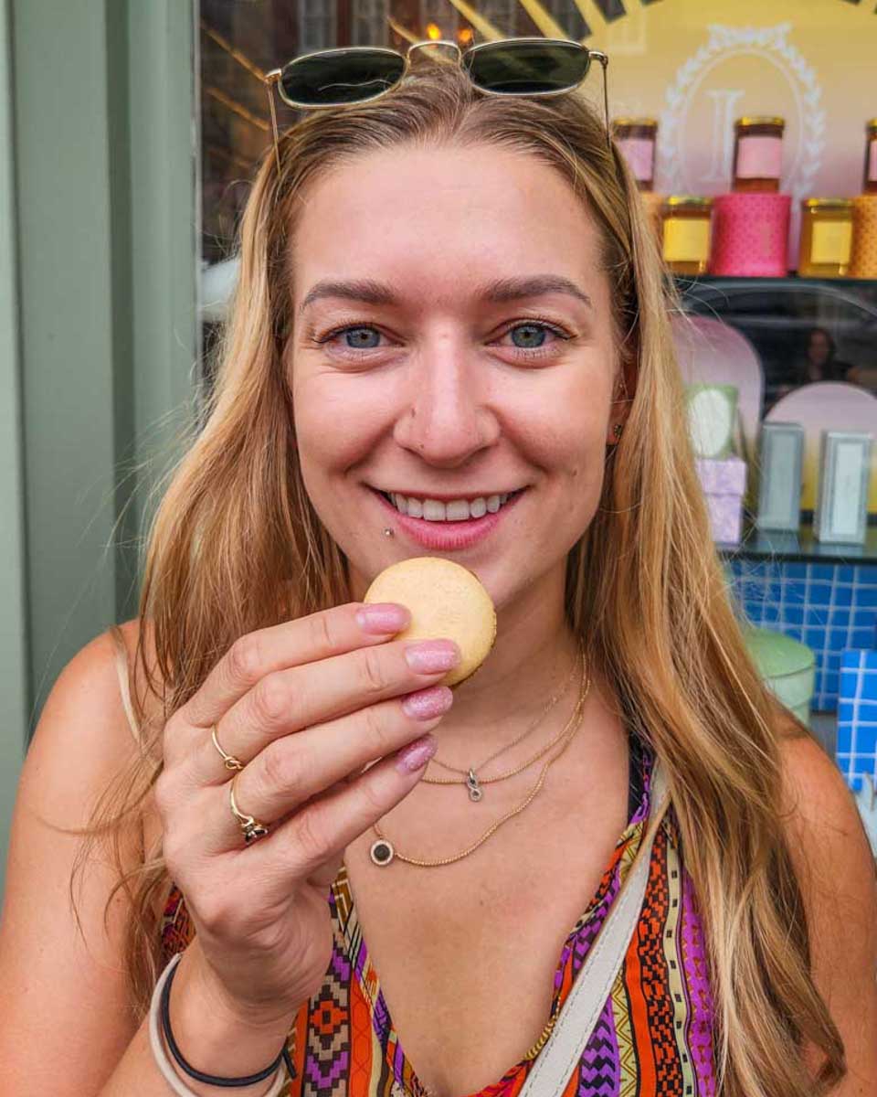 Bailey-tastes-a-macaron-she made during a cooking class in France