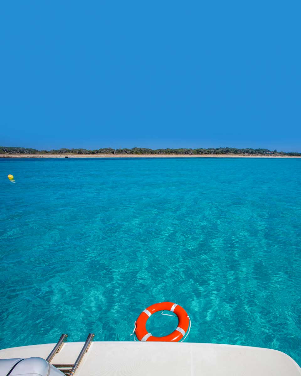 Formentera Island seen from sailboat on a tour from Ibiza Spain