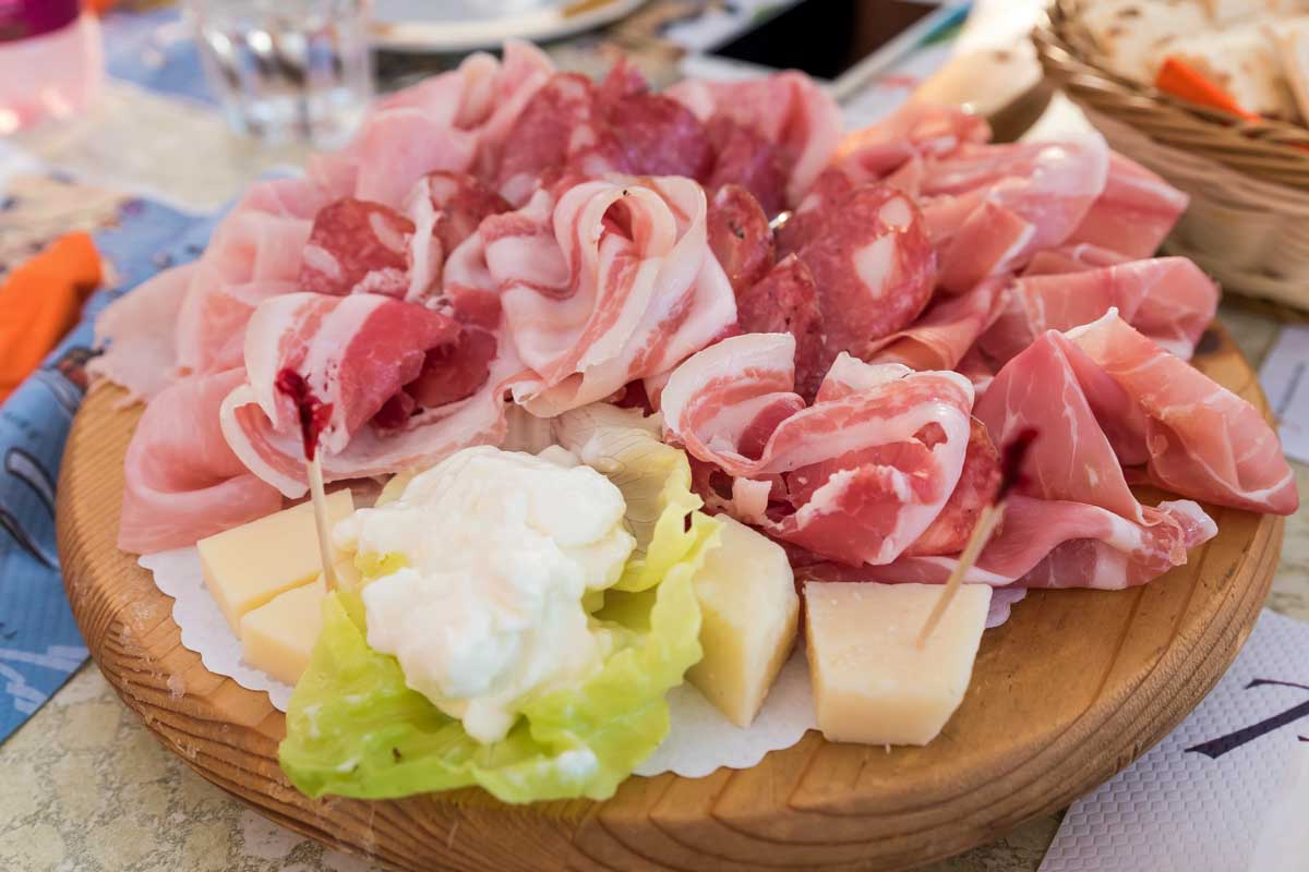 Meat and cheese eaten on a food tour in Krakow Poland