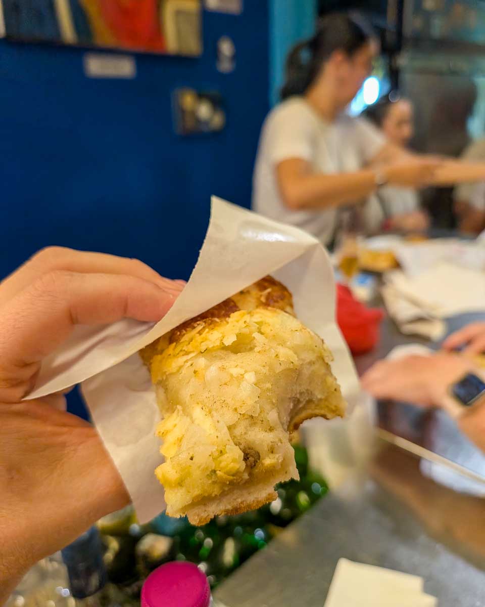 Someone-holding-food-on-a-food-tour-in-Catania Sicily