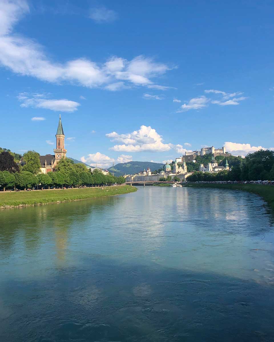 Walking along the Salzach River in Salzburg Austria