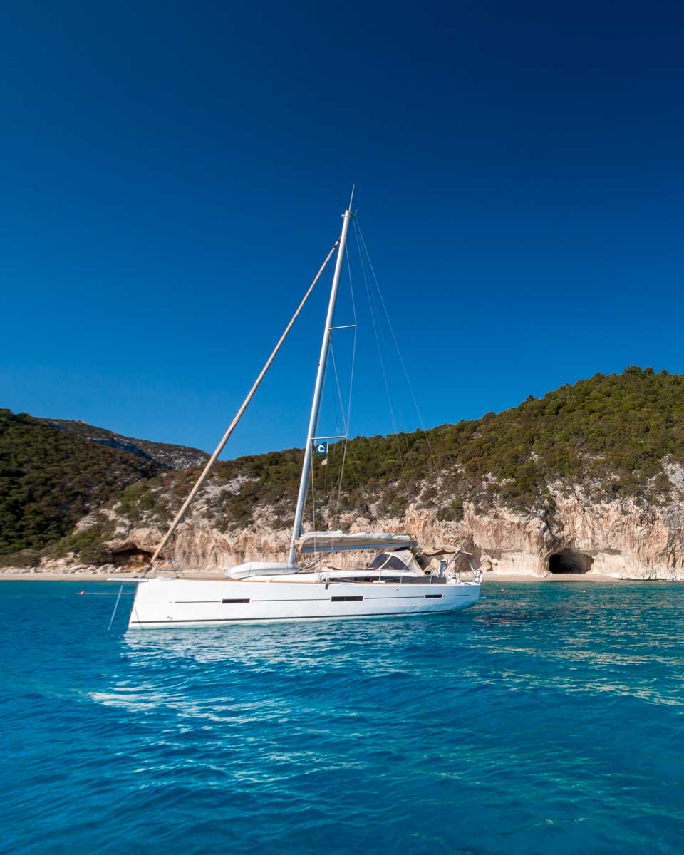 A sailboat along the coast of Sardinia on a tour from Cagliari Italy