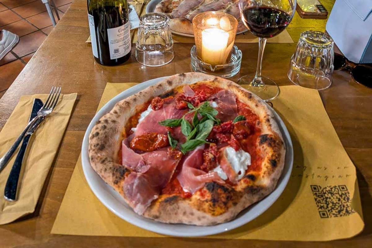 Bailey-eats-pizza-in-in Ljubljana, Slovenia