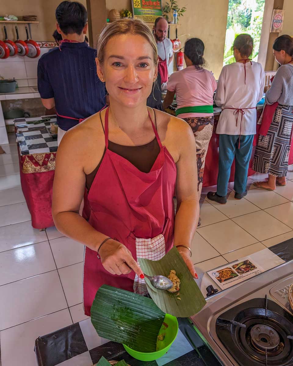 Bailey-wraps-food-in-banana-leaves-during-a-cooking-class-in-Chiang Mai-Thailand