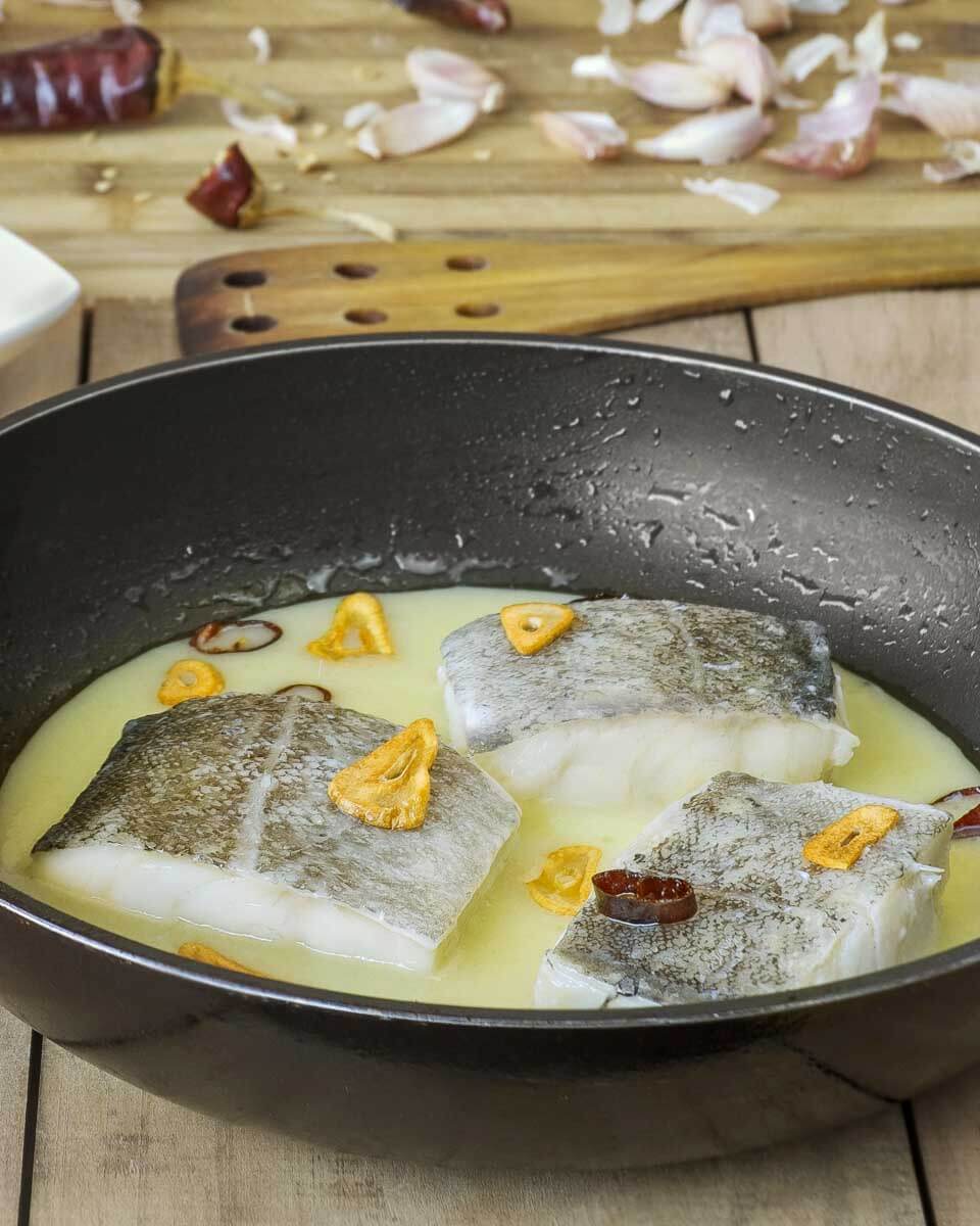 Fish being cooked during a cooking class in Spain