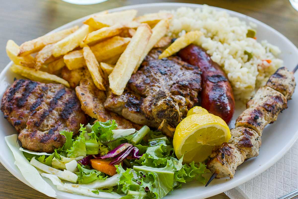 Greek-food-with-fries-eaten-for-dinner-in-Naxos-Greece