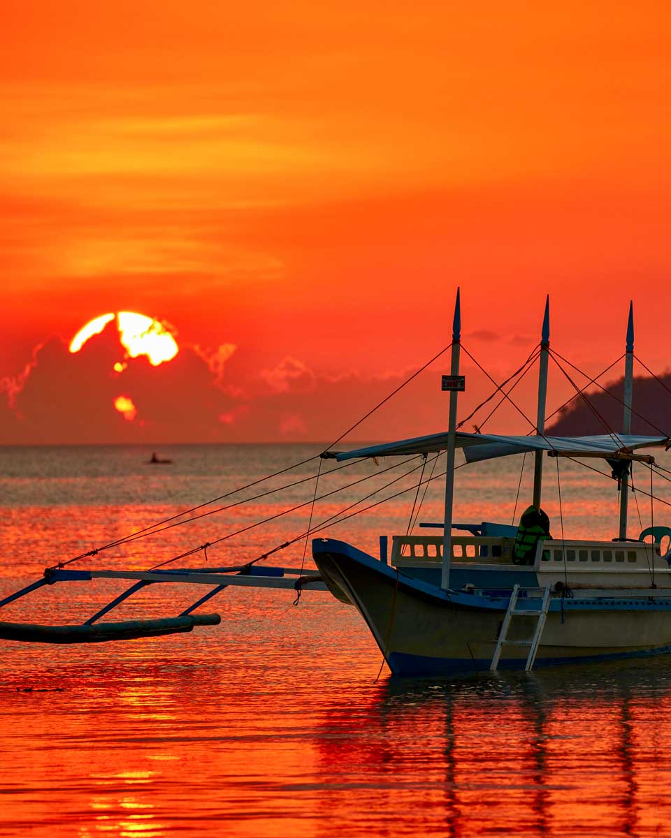 A boat at sunset in El Nido Philippines