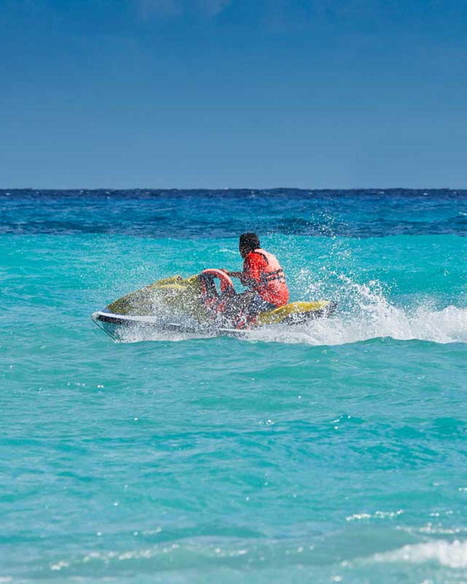 A-person-rides-a-jet-ski-in-Cabo San Lucas Mexico