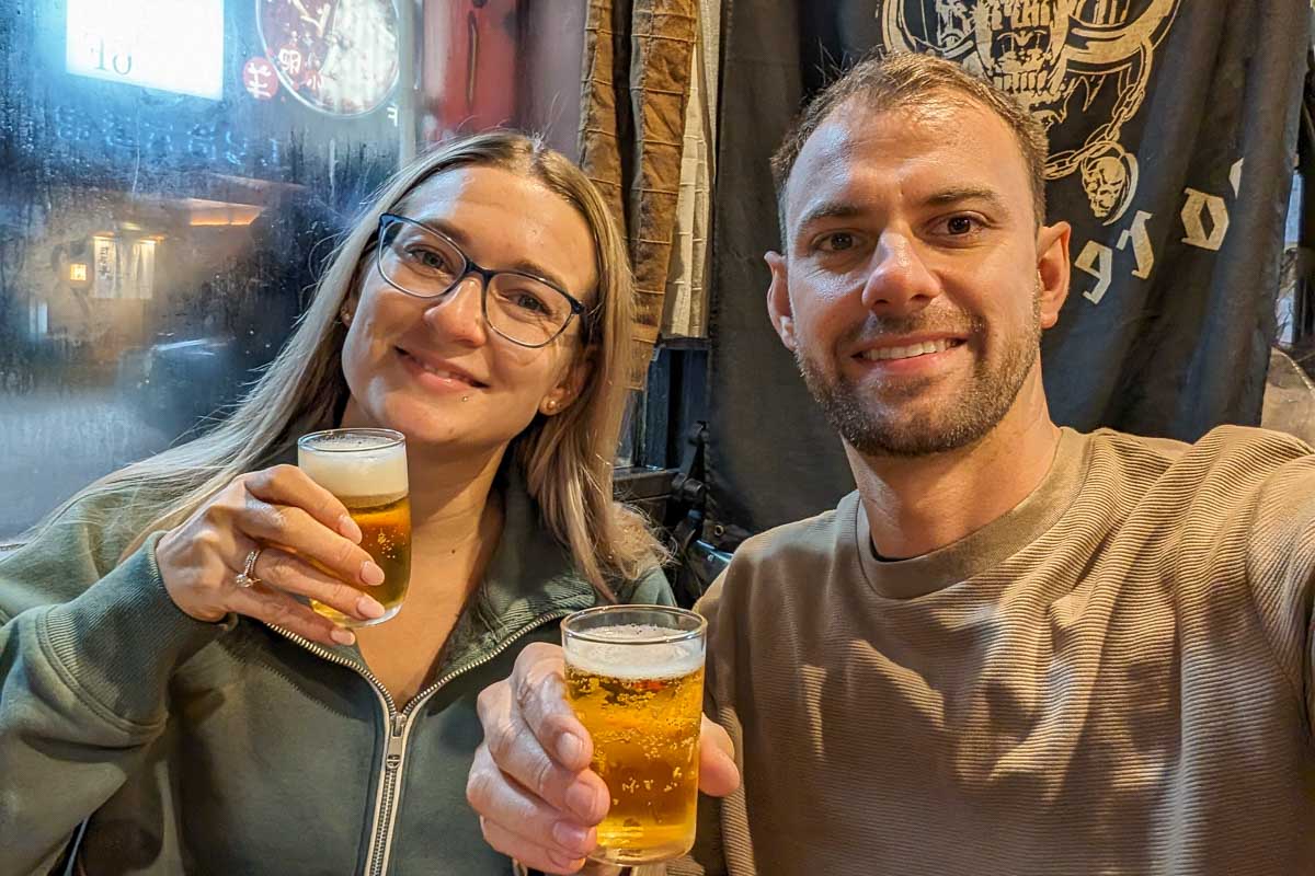 Bailey-and-Daniel-take-a-selfie-while-holding-two-drinks-in-Shanghai-China