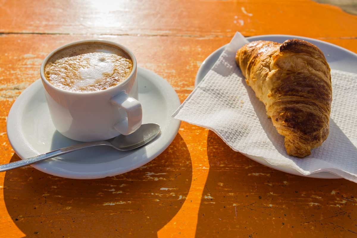 Cappuccino-with-croissant-for-breakfast-in-Bariloche Argentina