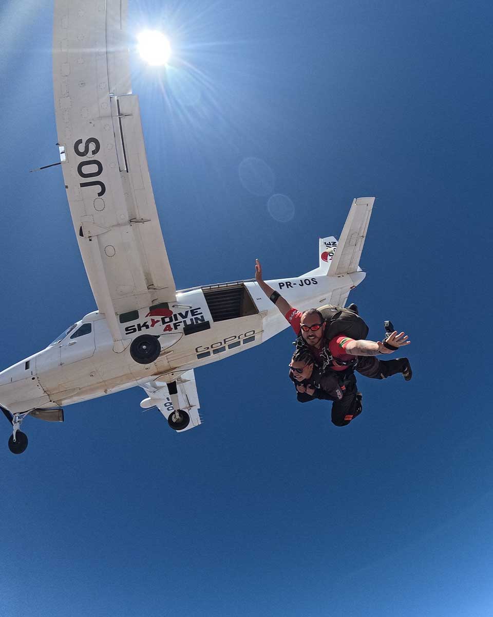 Two people tandem skydive in Sao Paulo
