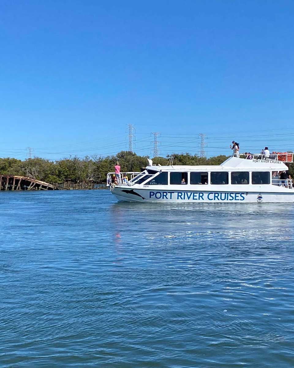 A boat from Port River Cruises looking for dolphins in Adelaide