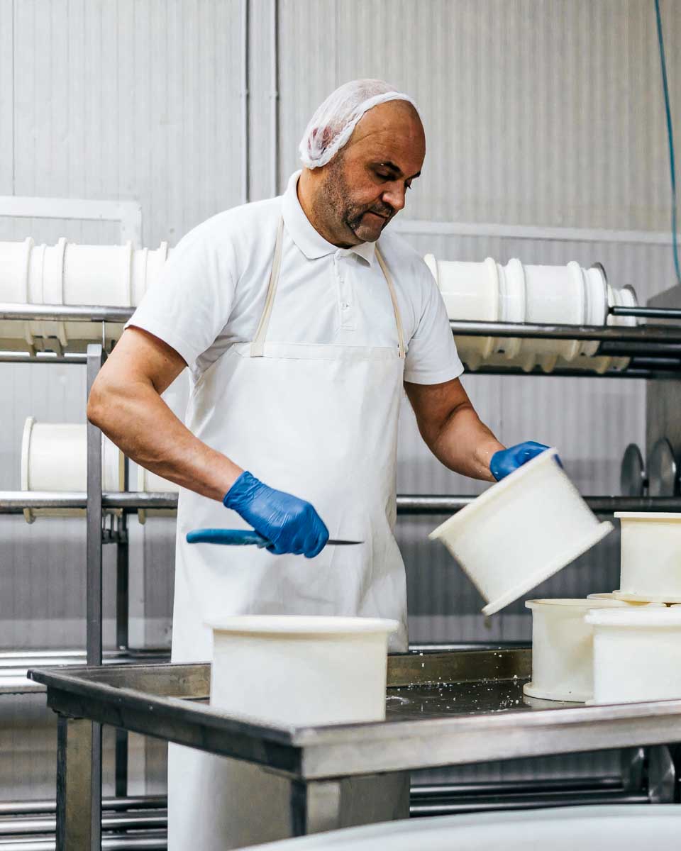 A man seen making cheese on a tour from Puglia Italy