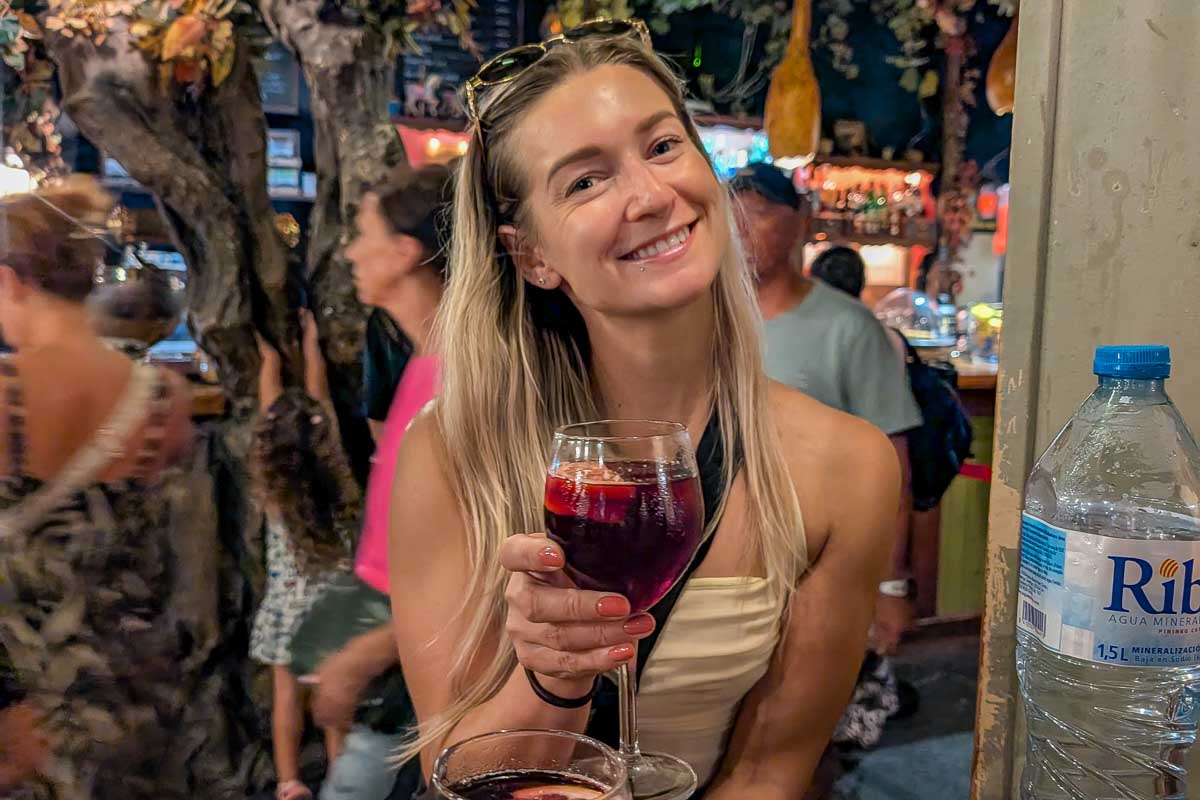 Bailey drinks a cocktail in Pisa Italy