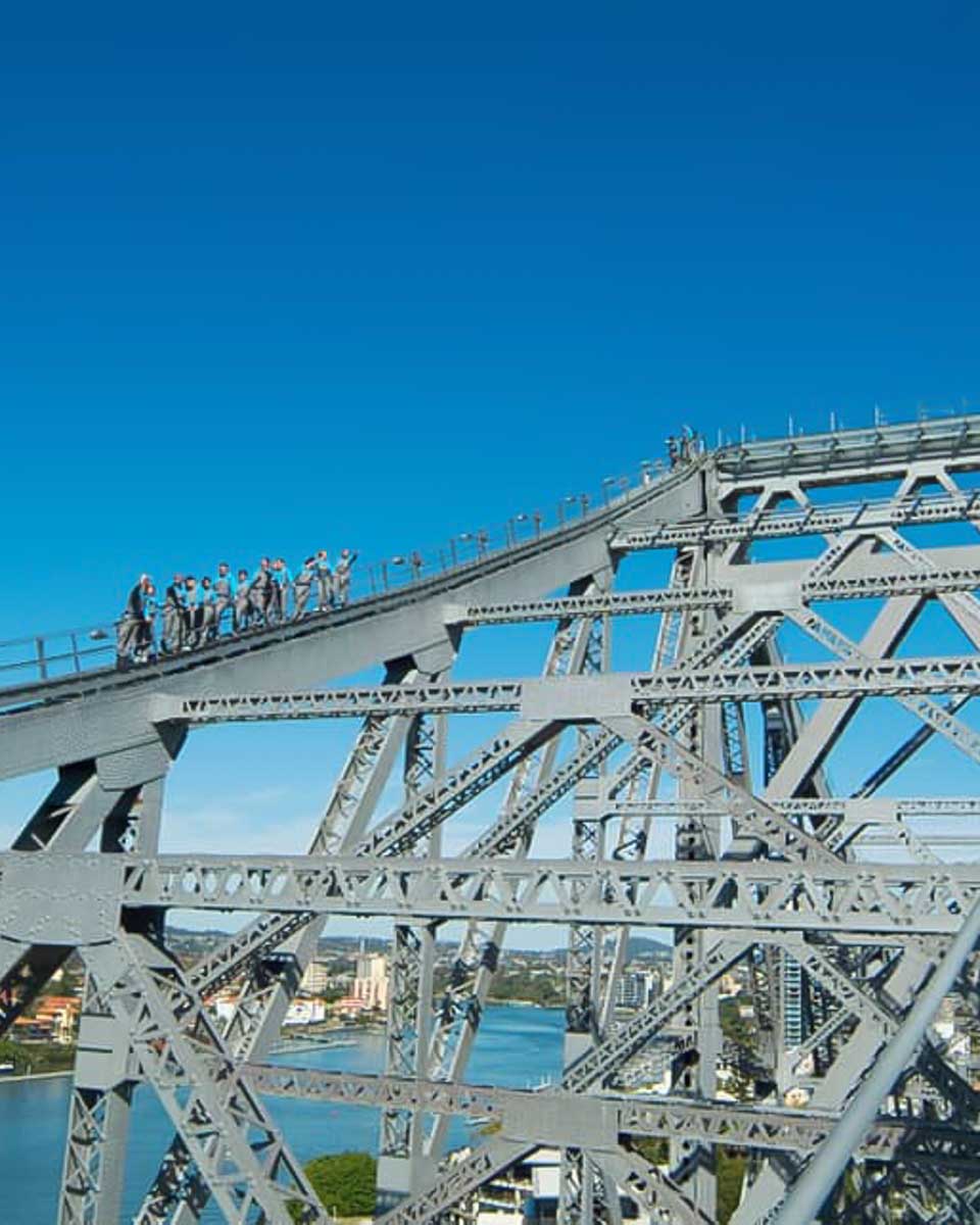 People climb up the Storey Bridge in Brisbane