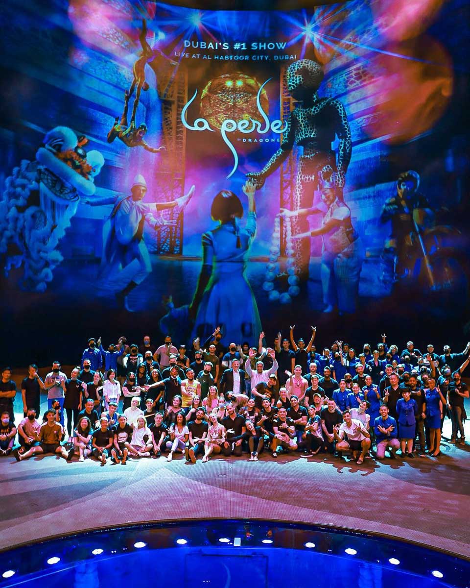 Performers take a picture together after the La Perle DXB show