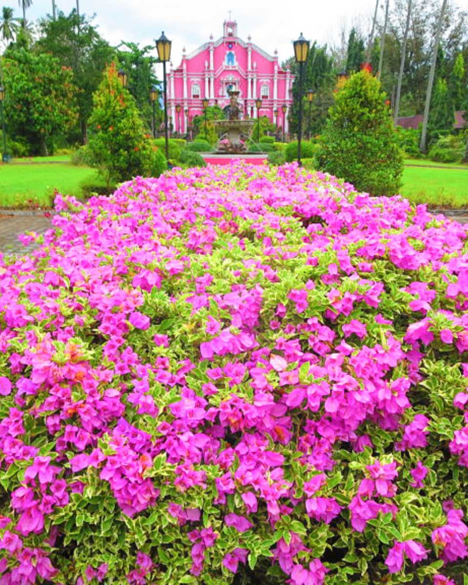 The pink memorial museum seen on a tour of Villa Escudero from Manila