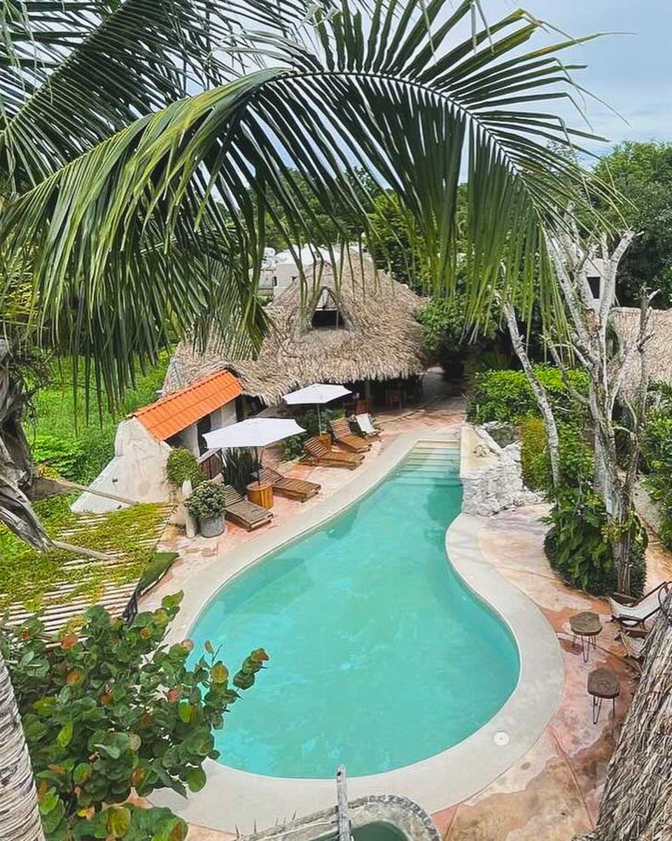 View of the pool area at Hotel Círculo Bacalar, Mexico