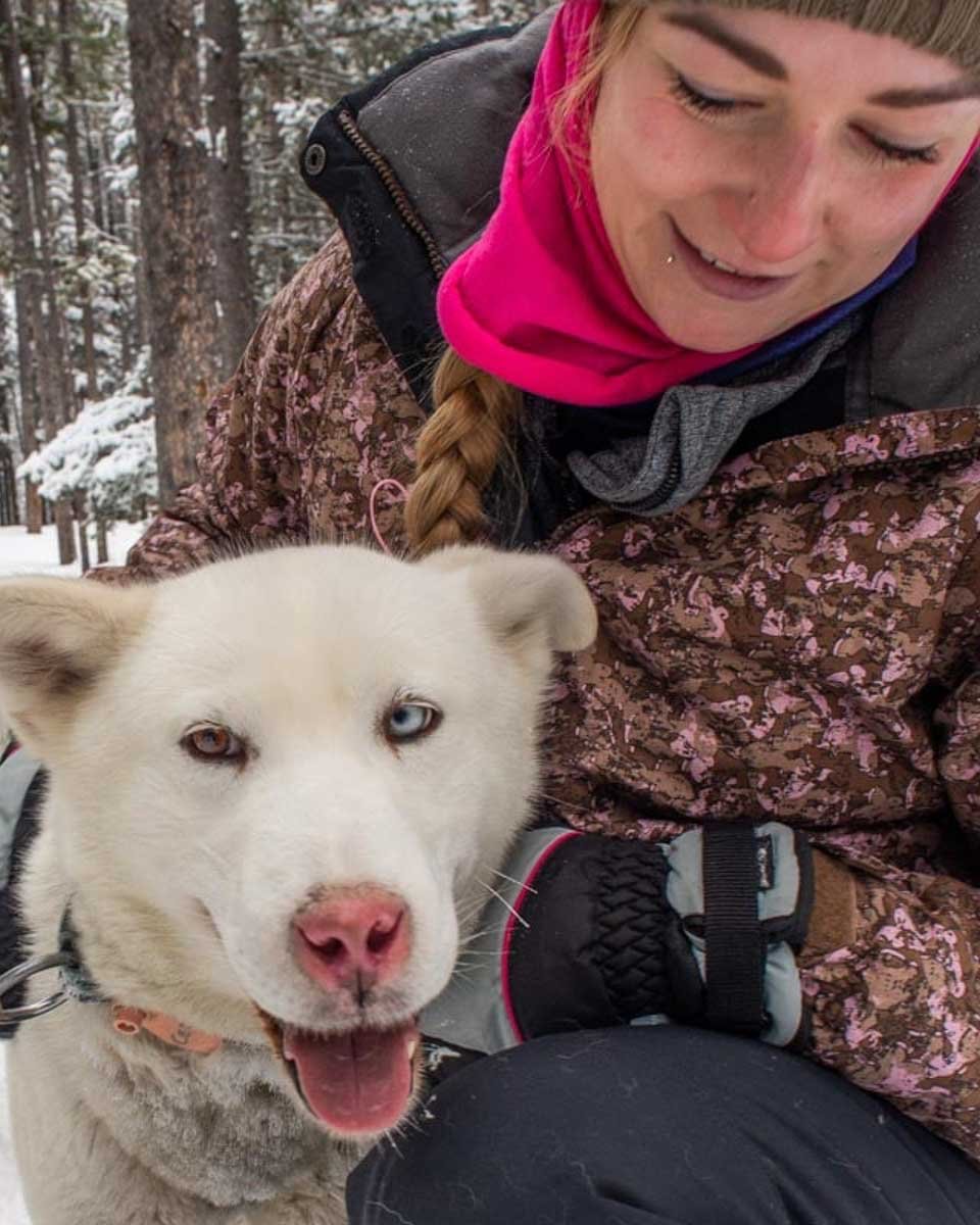 Bailey-with-a-sled-dog-on-a-tour-from-Rovaniemi Finland in winter