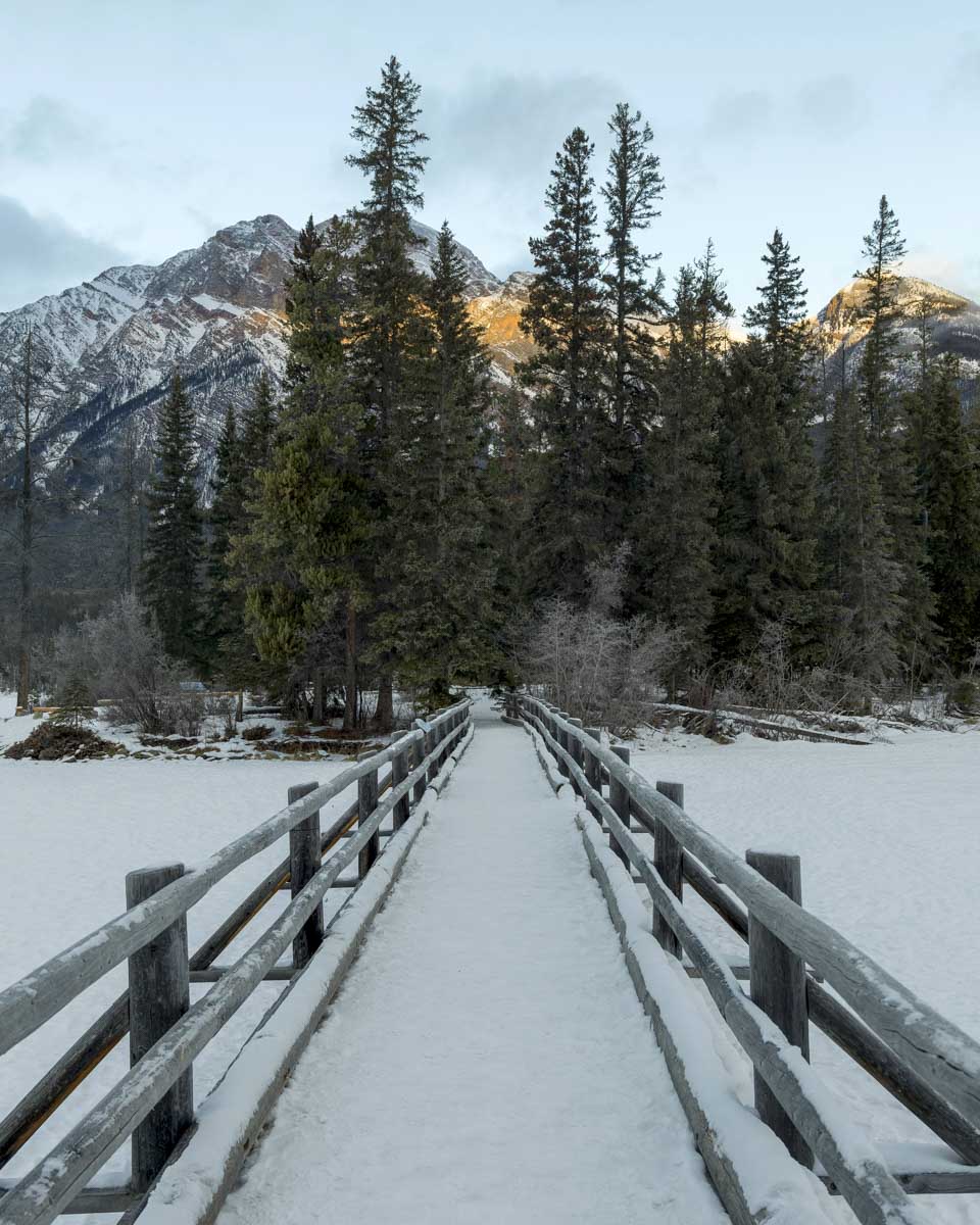 Snow covered bridge over frozen lake, Pyramid Lake Jasper AB Canada