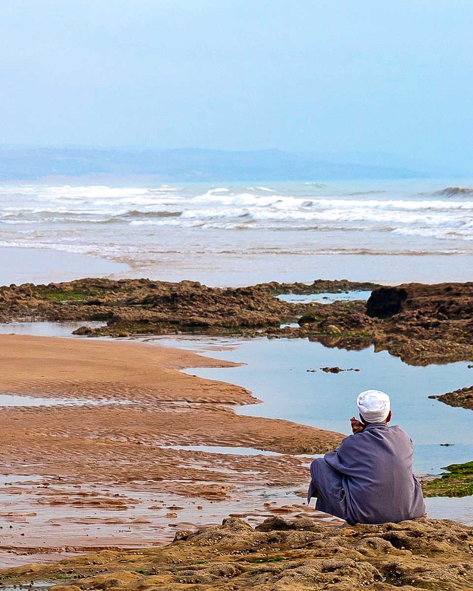 A man on the beach of sidi kaouki on a trip from Essaouira-Morocco