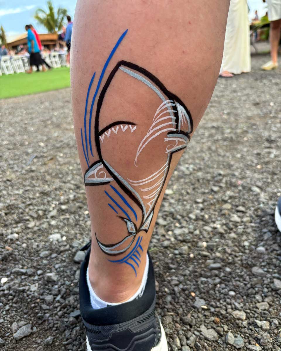 Hand painted tattoo at a luau on Oahu Hawaii USA
